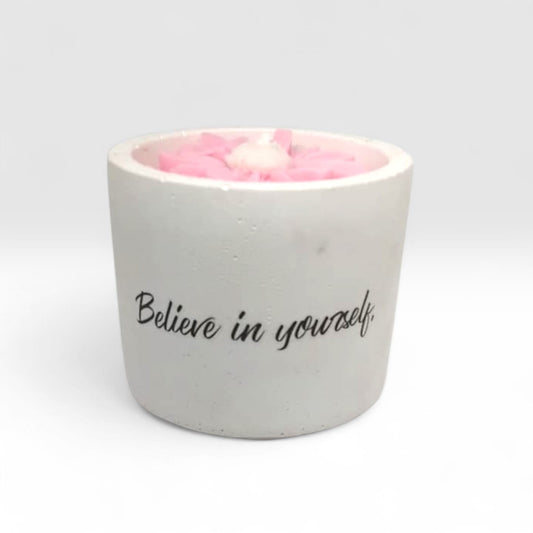 Luxury hand-poured soy wax candle in a handcrafted vessel with uplifting message